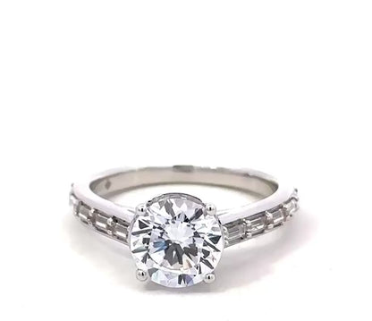 LADIES RING 2 1/4CT ROUND/BAGUETTE DIAMOND 14K WHITE GOLD (CENTER STONE ROUND DIAMOND 2CT )